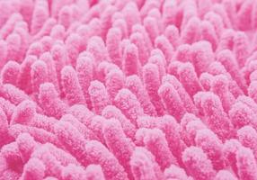 Closeup of pink carpet fabric texture for background use photo