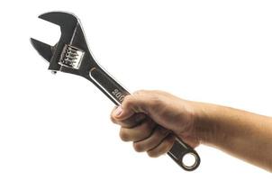 Man's hand holding big wrench isolated over white. Photo includes clipping path