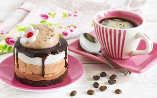 Cup of coffee and cake photo