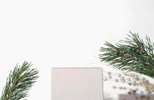 geometric podium for product presentation. pedestal or display for advertizing. pine branch and christmas decor. Scene with geometrical forms. Empty showcase photo