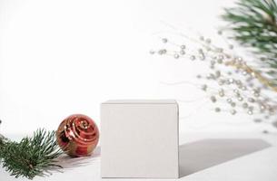 geometric podium for product presentation. pedestal or display for advertizing. variety of pine branch and christmas ball. Scene with geometrical forms. Empty showcase. eco friendly design. photo