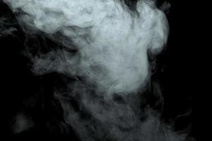 Abstract powder or smoke effect isolated on black background photo