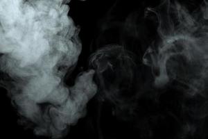 Abstract powder or smoke effect isolated on black background photo