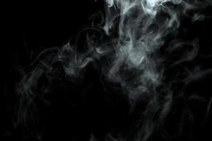 Abstract powder or smoke effect isolated on black background photo