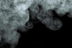 Abstract powder or smoke effect isolated on black background photo