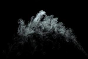 Abstract powder or smoke isolated on black background photo