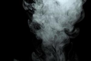 Abstract powder or smoke effect isolated on black background photo