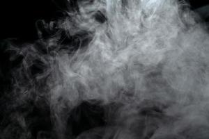 Abstract powder or smoke effect isolated on black background photo