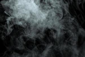 Abstract powder or smoke effect isolated on black background photo