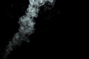 Abstract powder or smoke isolated on black background photo