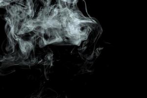 Abstract powder or smoke effect isolated on black background photo