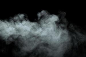 Abstract powder or smoke effect isolated on black background photo