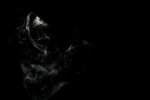 Abstract powder or smoke isolated on black background photo