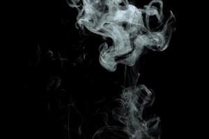 Abstract powder or smoke effect isolated on black background photo