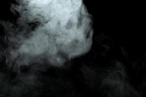 Abstract powder or smoke effect isolated on black background photo