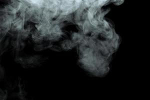 Abstract powder or smoke effect isolated on black background photo