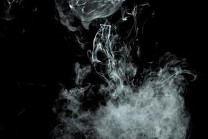 Abstract powder or smoke effect isolated on black background photo