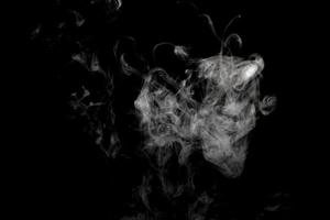 Abstract powder or smoke isolated on black background photo