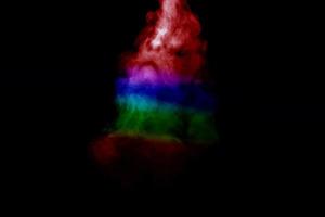 Abstract smoke isolated on black background,Rainbow powder photo