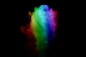 Abstract smoke isolated on black background,Rainbow powder photo