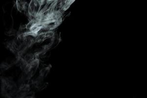 Abstract powder or smoke effect isolated on black background photo