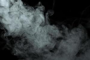 Abstract powder or smoke effect isolated on black background photo