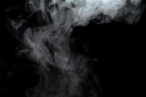 Abstract powder or smoke effect isolated on black background photo