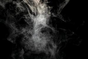 Abstract powder or smoke isolated on black background photo