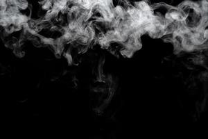 Abstract powder or smoke isolated on black background photo