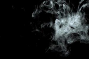 Abstract powder or smoke effect isolated on black background photo