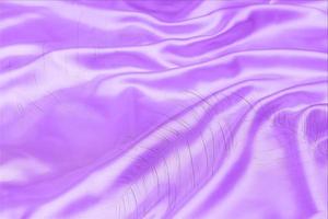 purple satin fabric texture soft blur with palm leaves pattern background photo