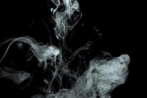 Abstract powder or smoke effect isolated on black background photo