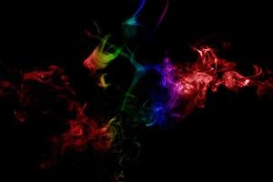 Abstract smoke isolated on black background,Rainbow powder photo