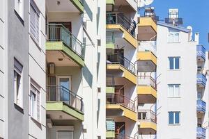 Close up of a multi apartment panel house with air conditioning photo