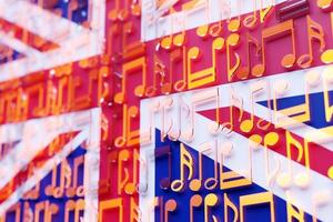 Musical notes lined up in even rows against the backdrop of the National Flag of United Kingdom. The concept of the national anthem, music photo