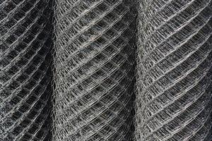Chrome grille 3D detail for building. Close up pattern of a furnace filter. Black and white close up of a sidewalk subway grate with shallow depth of field. photo