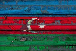 The national flag of Azerbaijan is painted on uneven boards. Country symbol. photo