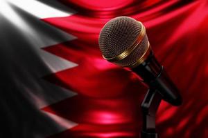 Microphone on the background of the National Flag of Bahrain, realistic 3d illustration. music award, karaoke, radio and recording studio sound equipment photo