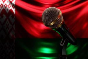 Microphone on the background of the National Flag of Belarus, realistic 3d illustration. music award, karaoke, radio and recording studio sound equipment photo