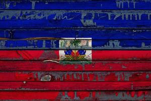 The national flag of Haiti  is painted on uneven boards. Country symbol. photo