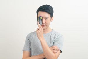 young Asian man holding credit card photo