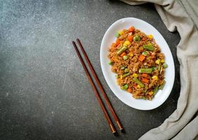 fried rice with green peas, carrot and corn photo