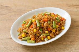 fried rice with green peas, carrot and corn photo