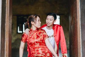 Happy young Asian couple in Chinese traditional dresses photo