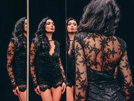 portrait of beautiful, attractive slim brunette woman near the mirrors. Fashion, style concept photo
