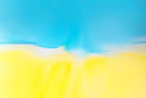 Abstract blue and yellow fragment of colorful background, wallpaper. Mixing acrylic paints. Modern art. Marble texture. Alcohol ink colors translucent. Alcohol Abstract contemporary art fluid. photo