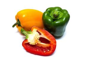 Three sweet peppers in yellow, red and green color photo