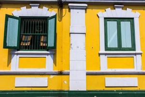 Old Windows and yellow wall photo