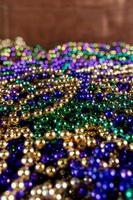 Close-up of Mardi Gras beads in pile photo