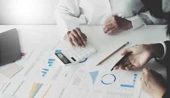 Two executive discussing company growth project success financial statistics, Partner meeting professional investor working start up project for both company with document, laptop and digital tablet. photo